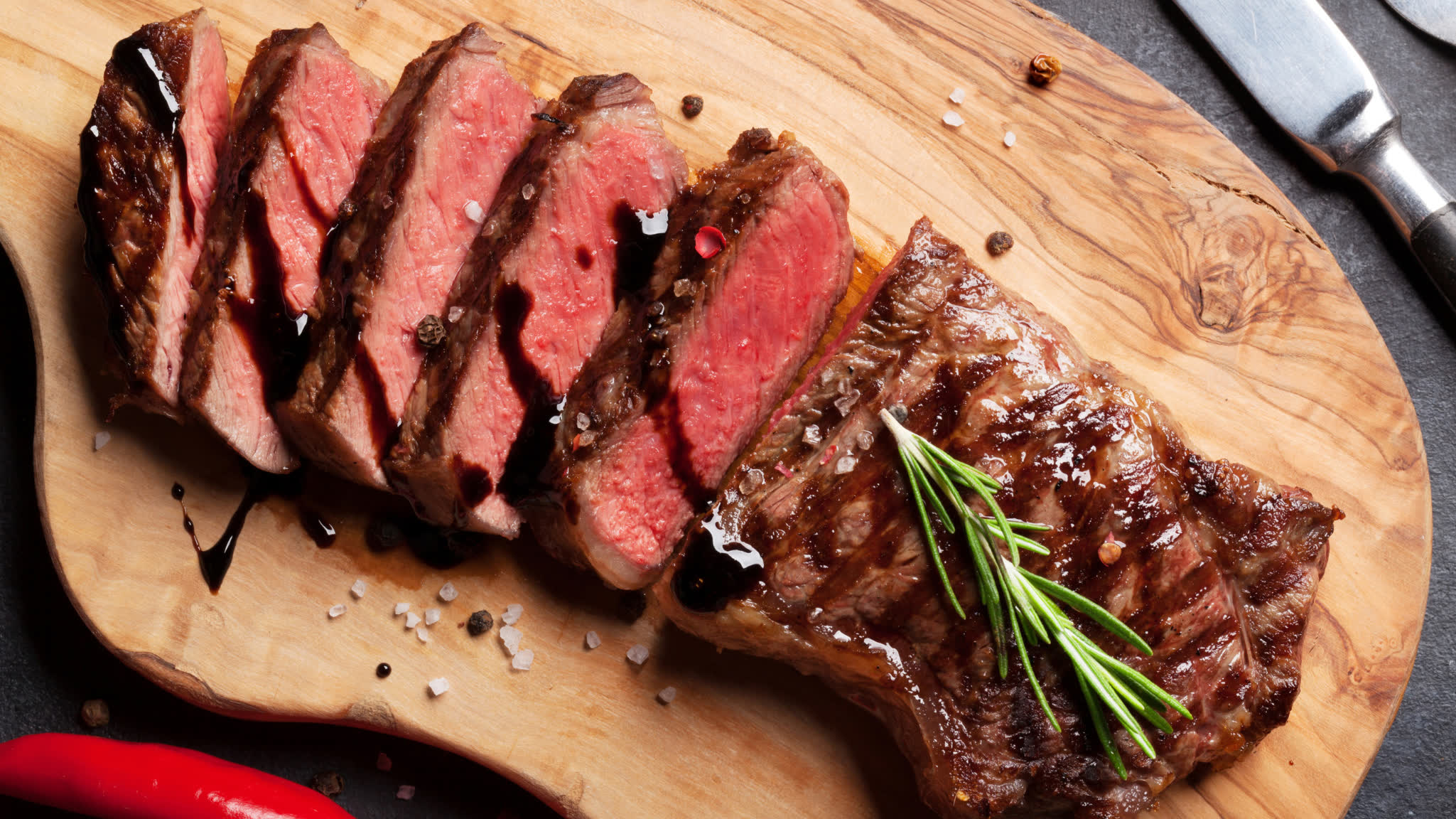 Sliced steak on a cutting board